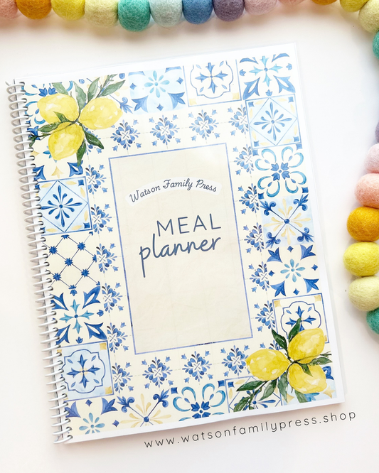 Meal planner with blue tile and floral lemon design on a white background